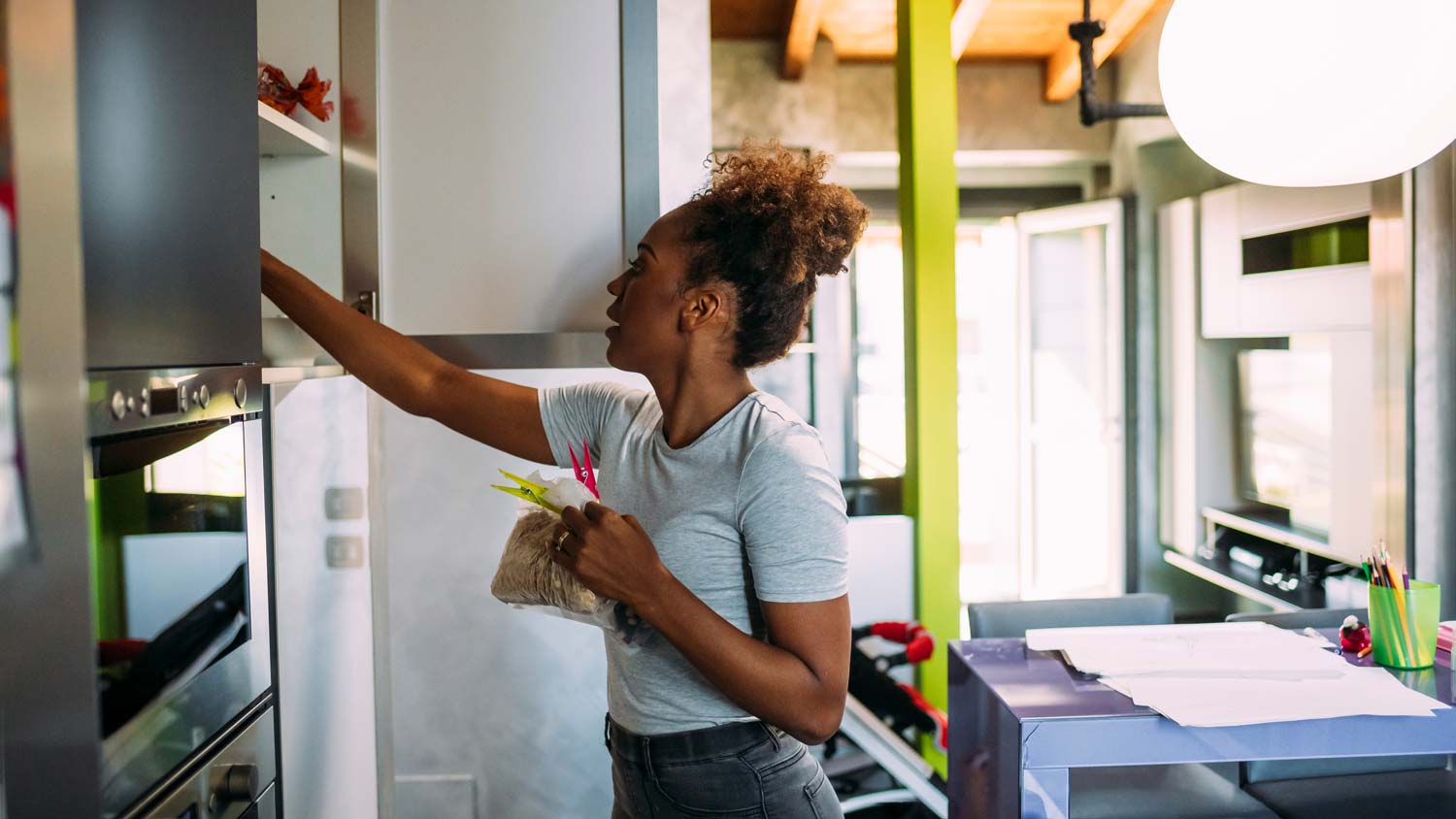 Woman searching cabinets
