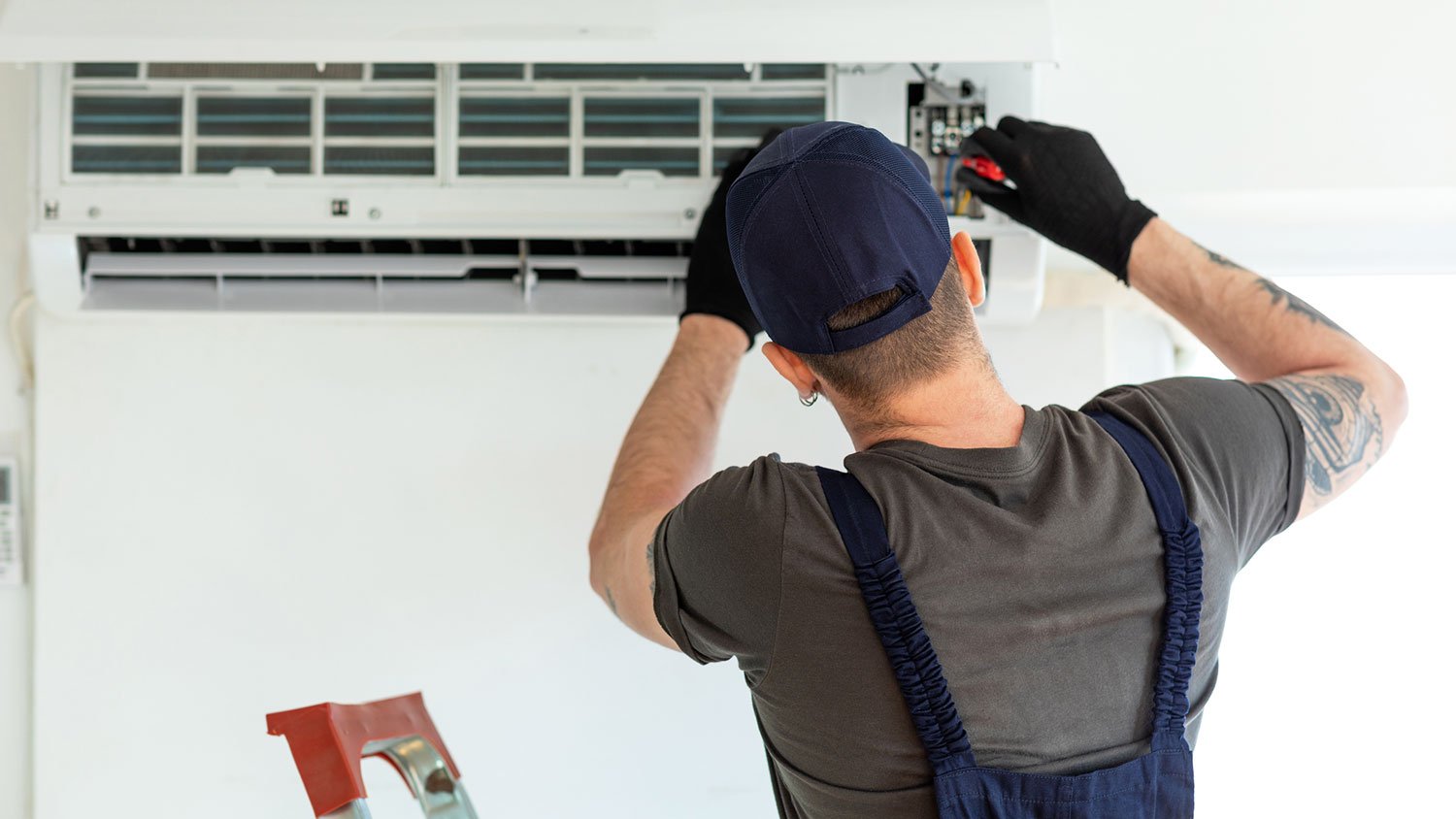 Technician tunning up ac unit