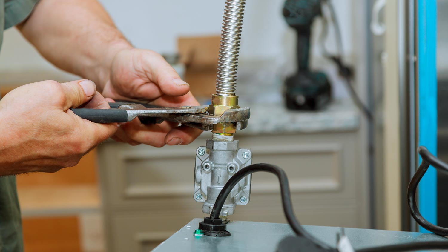man adjusting gas hob 