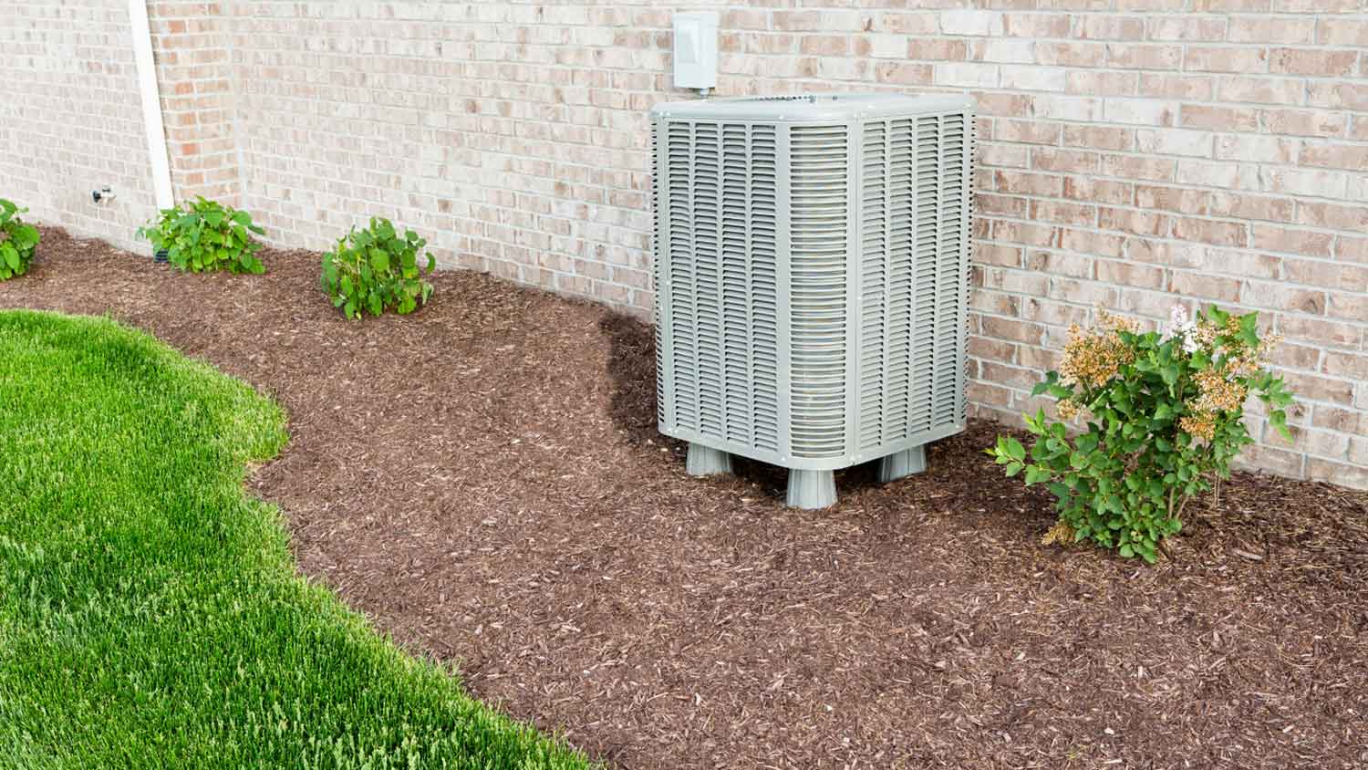 Air conditioner condenser pump unit in the backyard