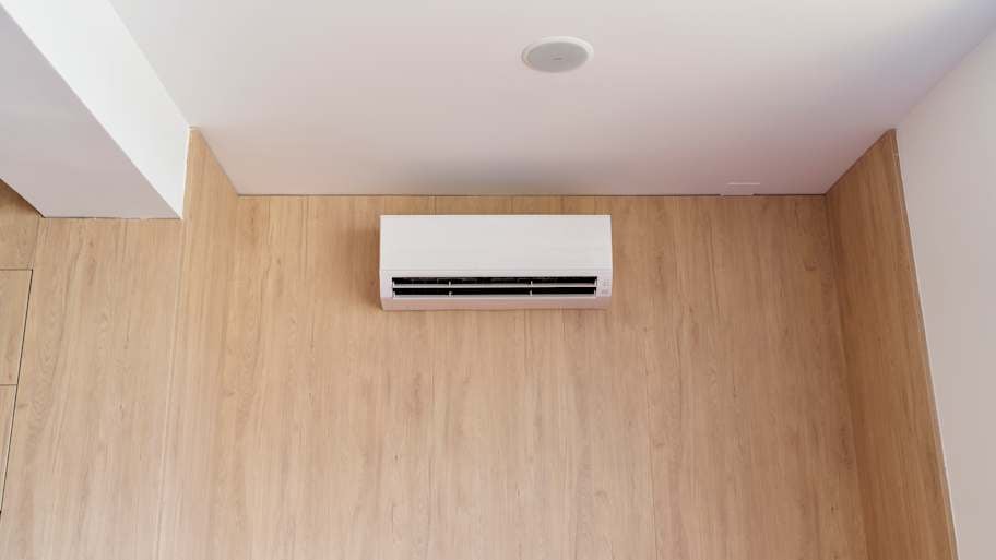 Air conditioning console in wooden wall