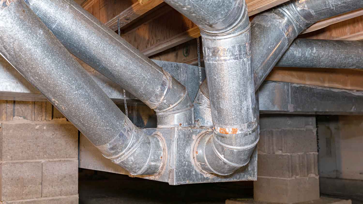 Air duct pipes installed in a crawl space of a home