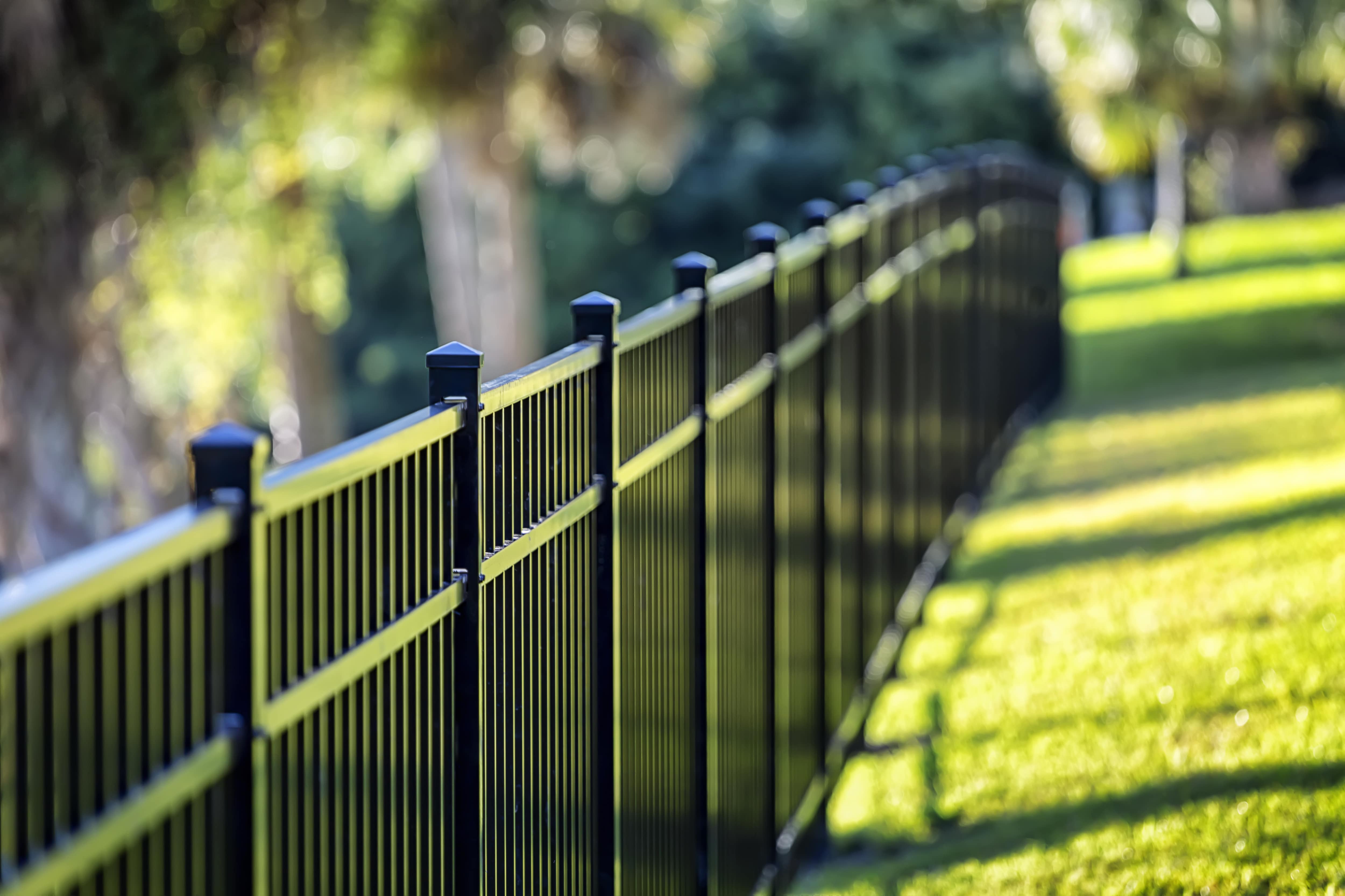 Black linear aluminum fence in yard