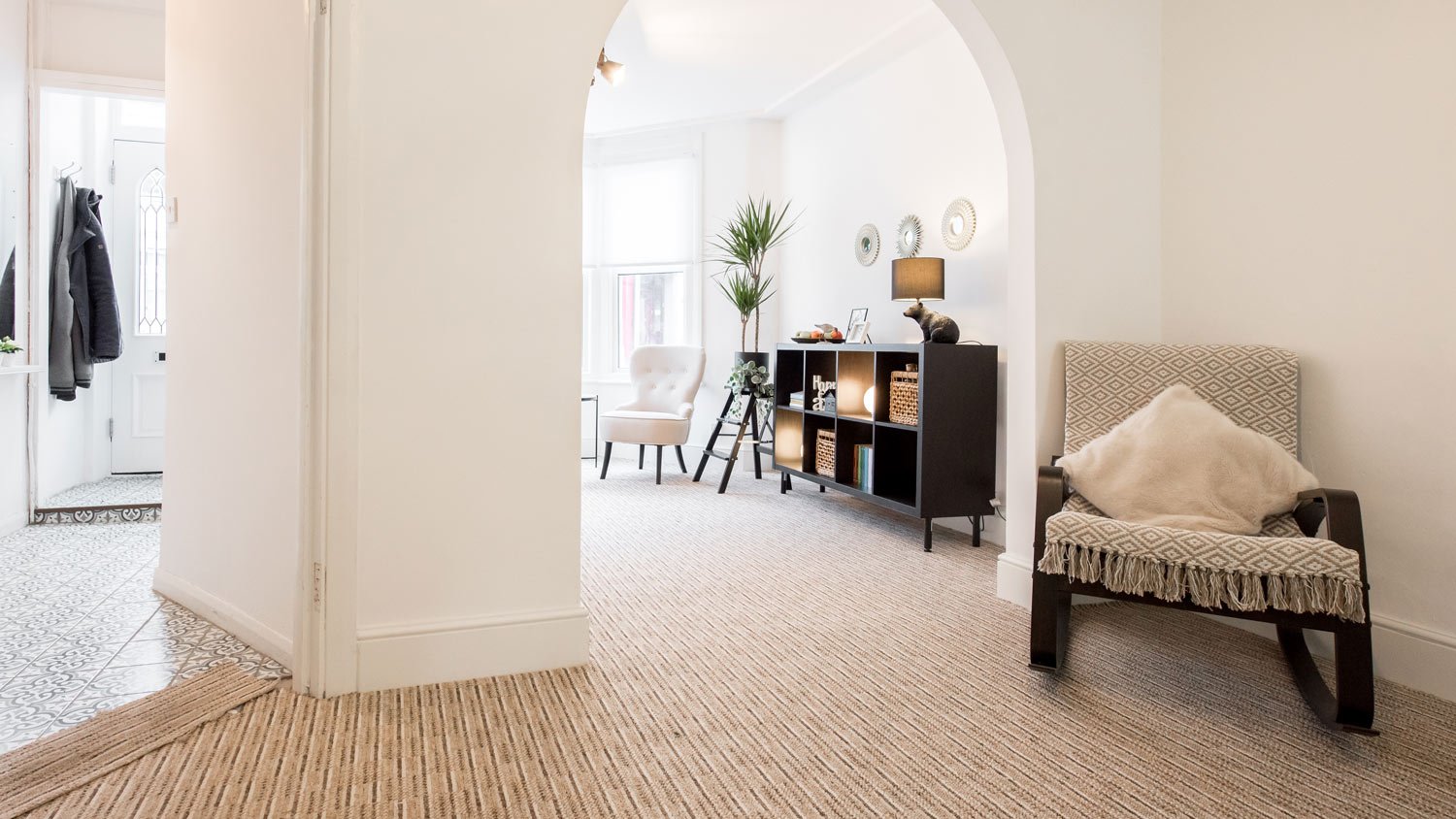 A general interior view of a lounge with beige carpet