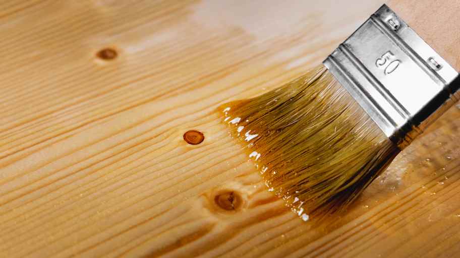 Applying transparent varnish on wood