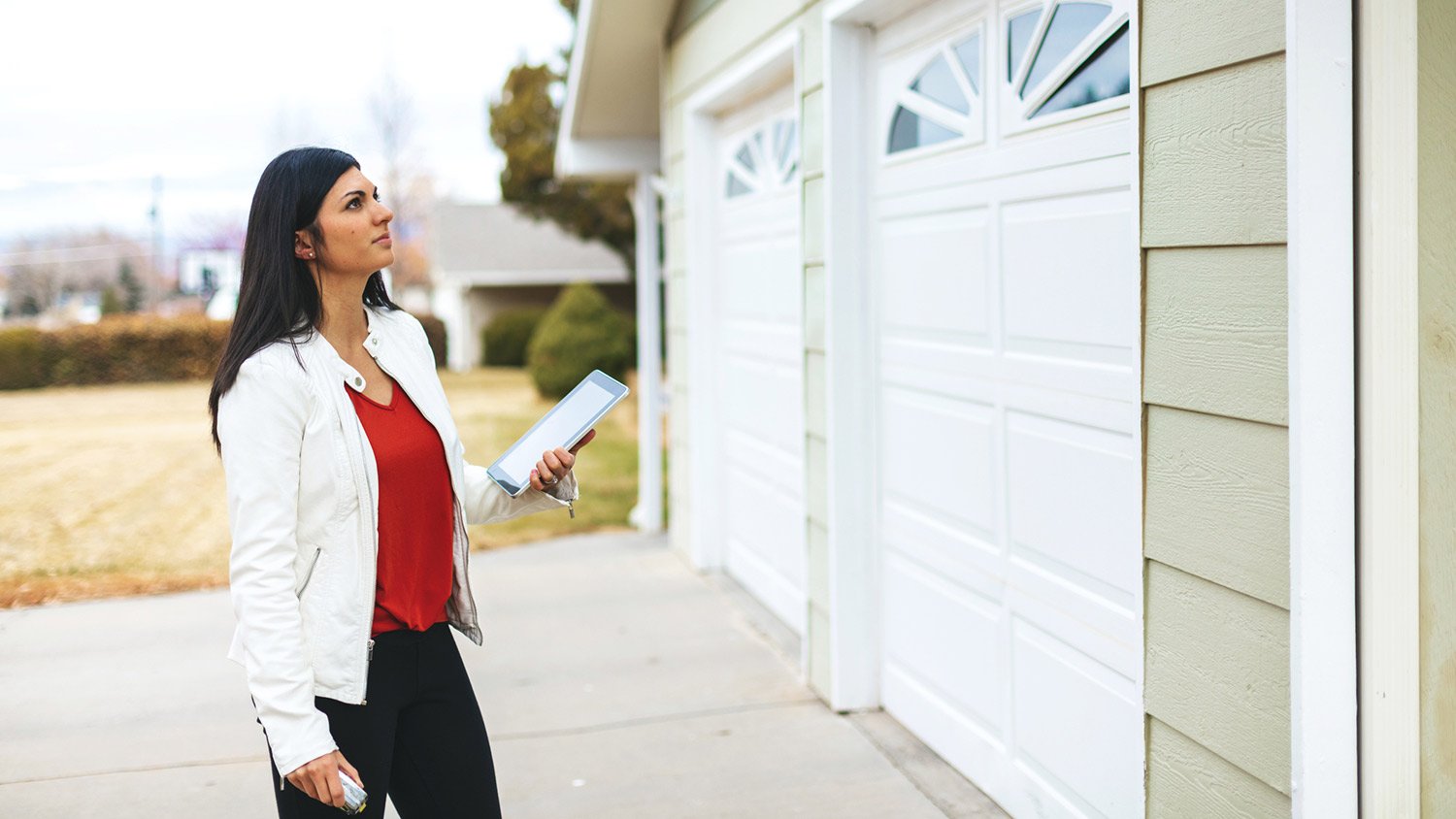 Appraiser looks over house