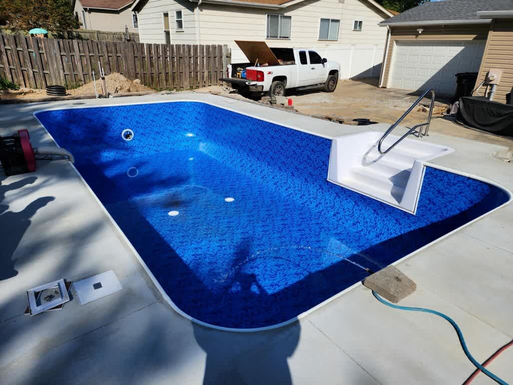 pool with blue liner being filled