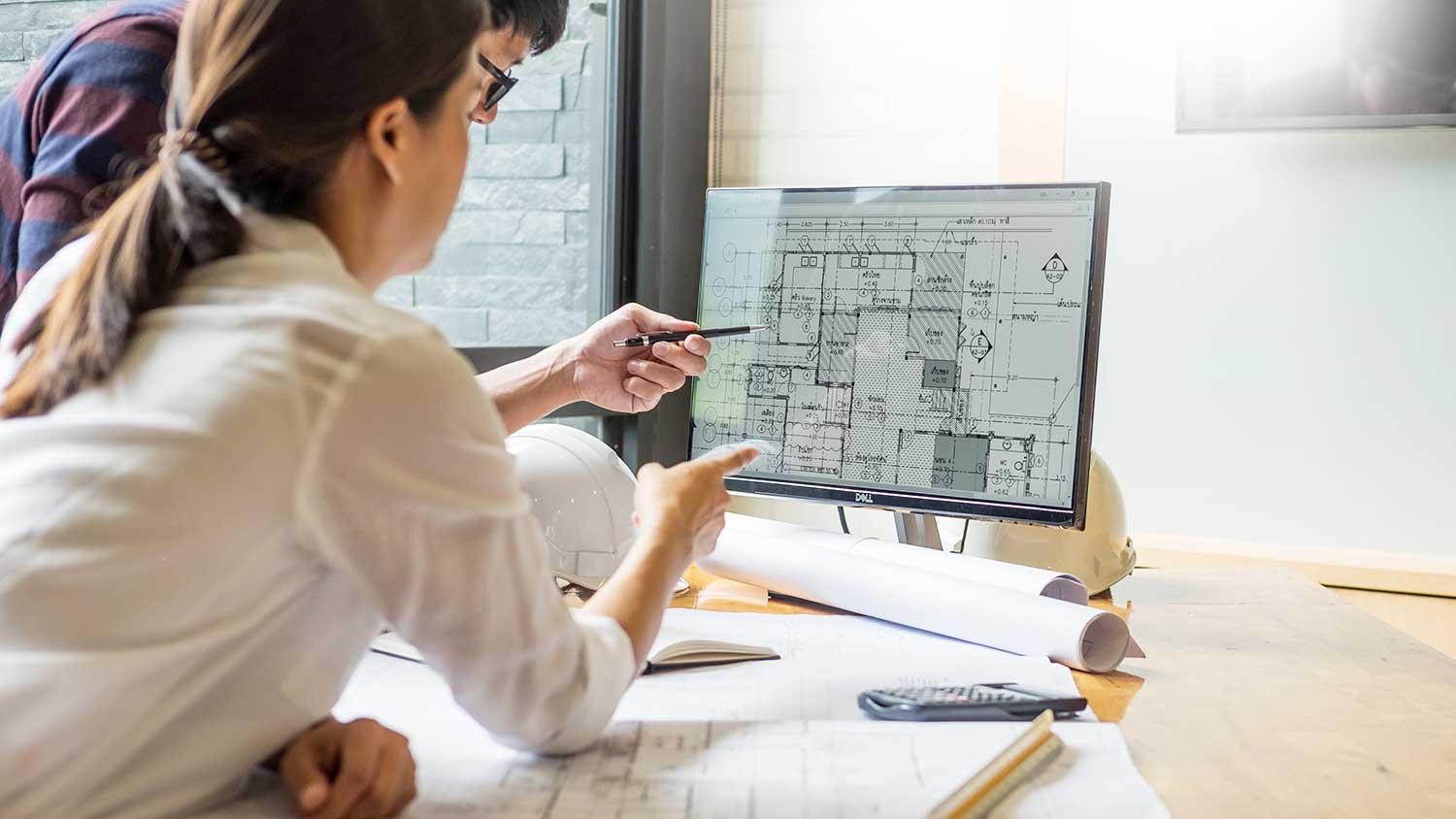 Architect reviewing design on the computer