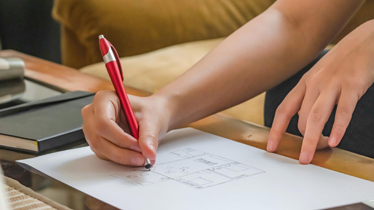 An architect sketching a custom floor plan