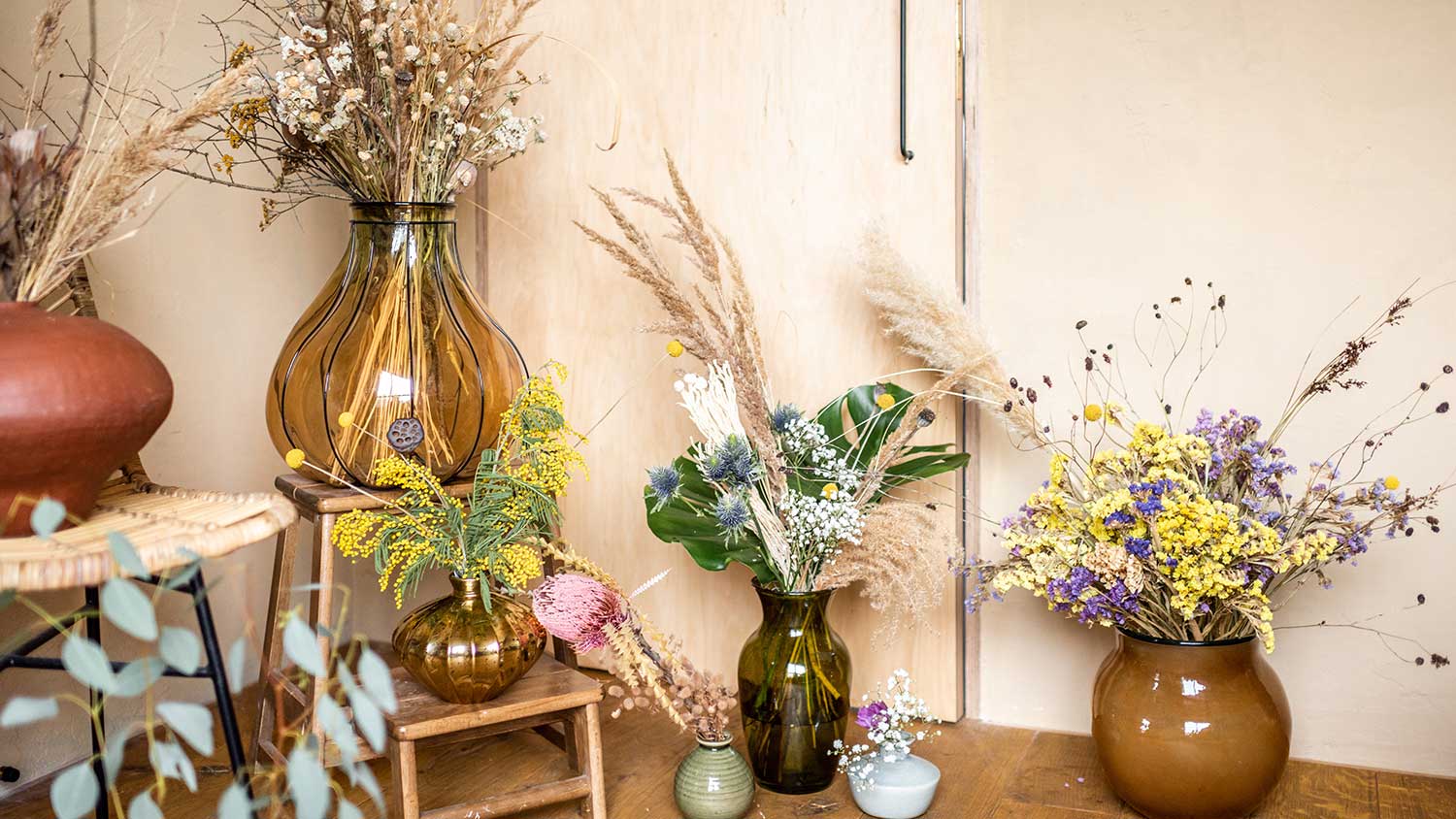 Assorted flower vases with dry flowers 