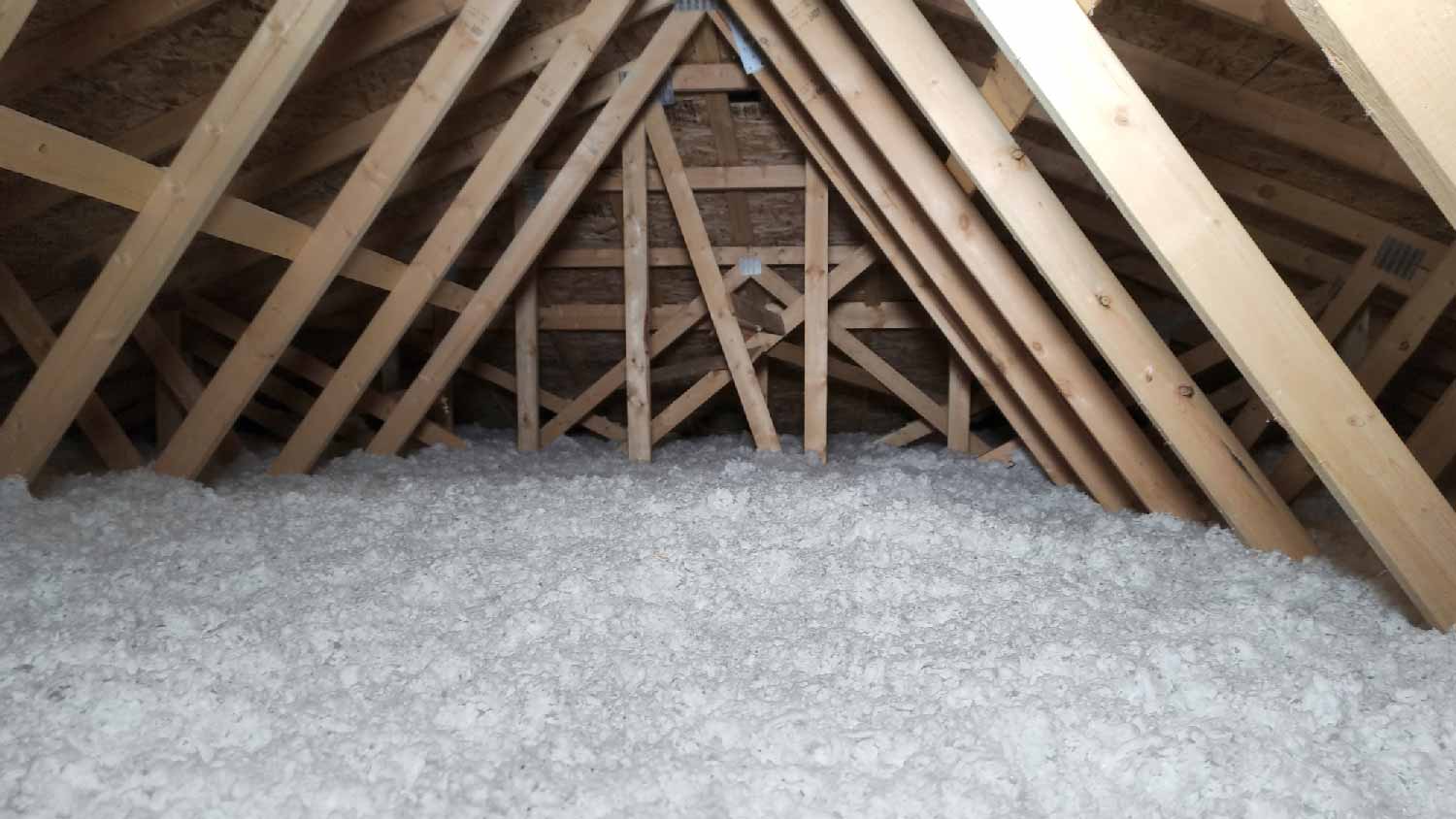 A house’s attic with blown in insulation