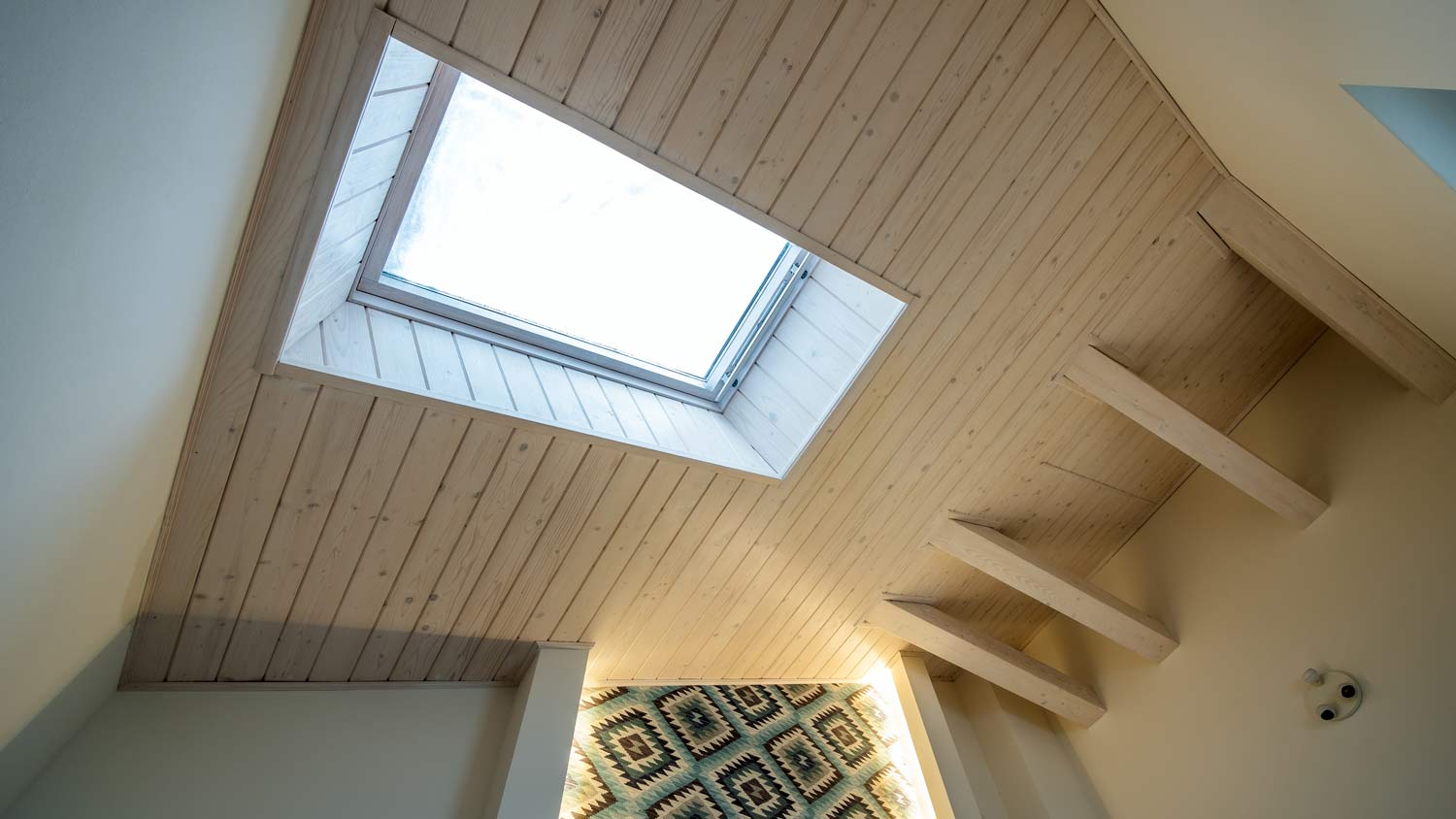 attic ceiling with skylight