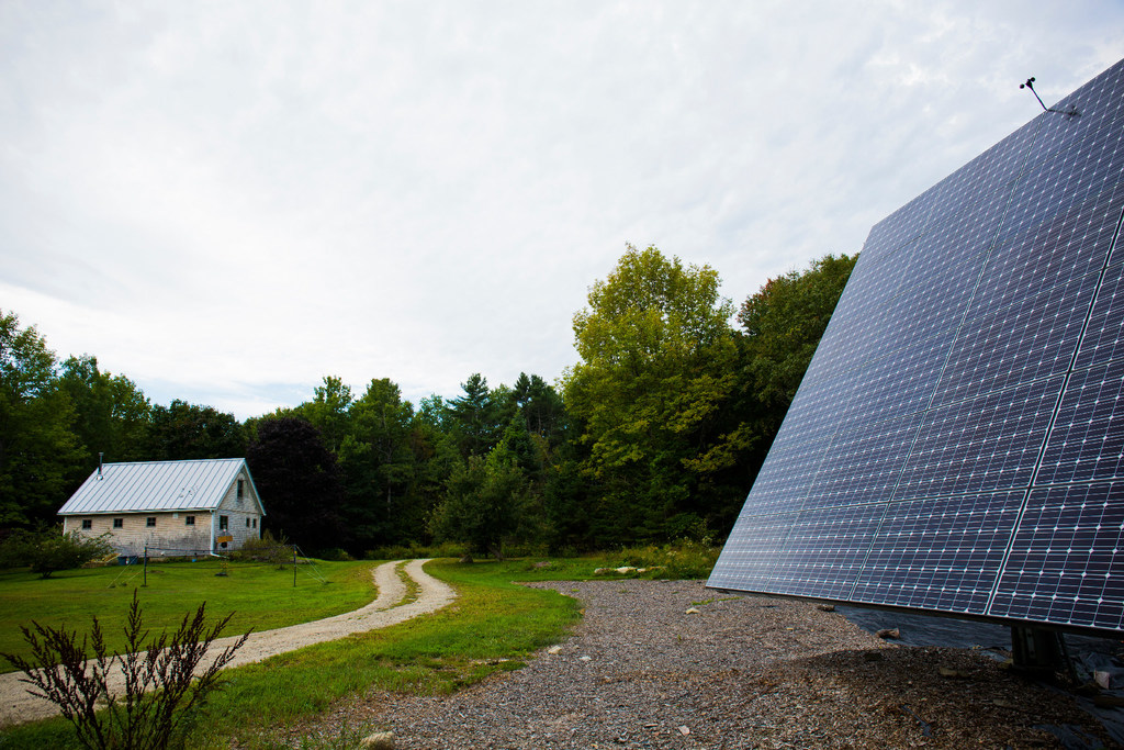 A Maine barn home with a yard solar array