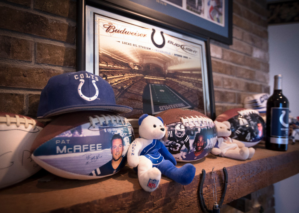 Fireplace mantle with Indianapolis Colts items at home of Ray and Diane Bridges