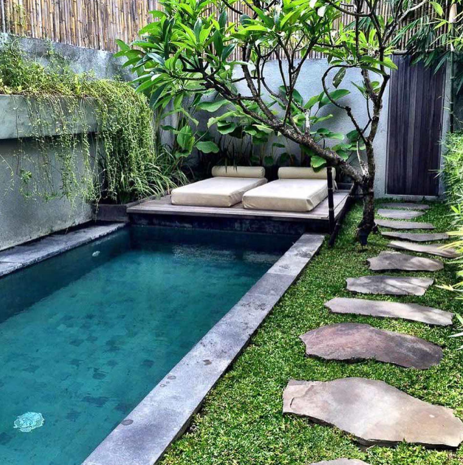 A backyard with a small pool