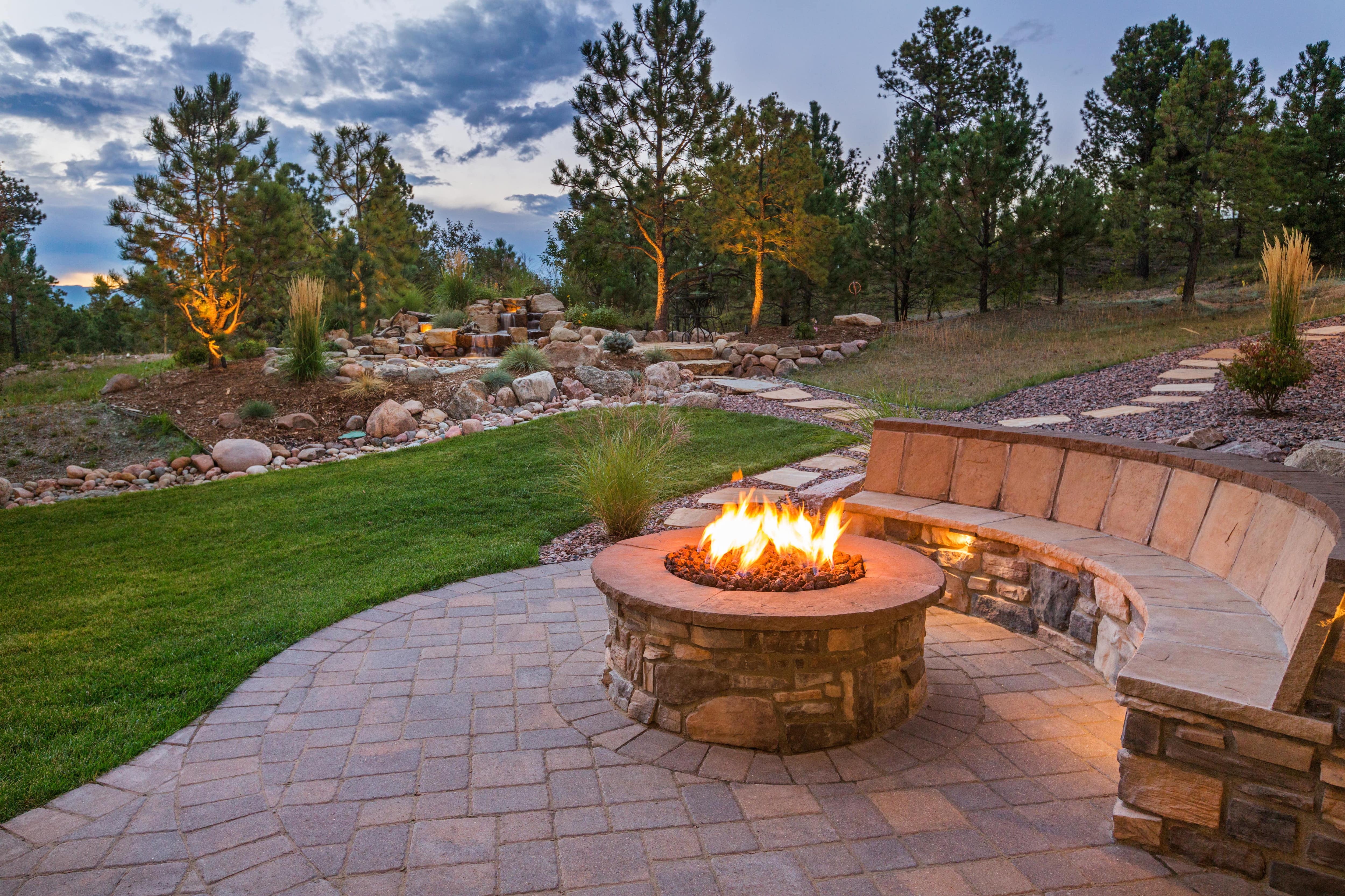 Backyard fire pit and stone patio