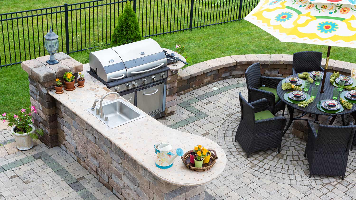 Backyard grill and table area.