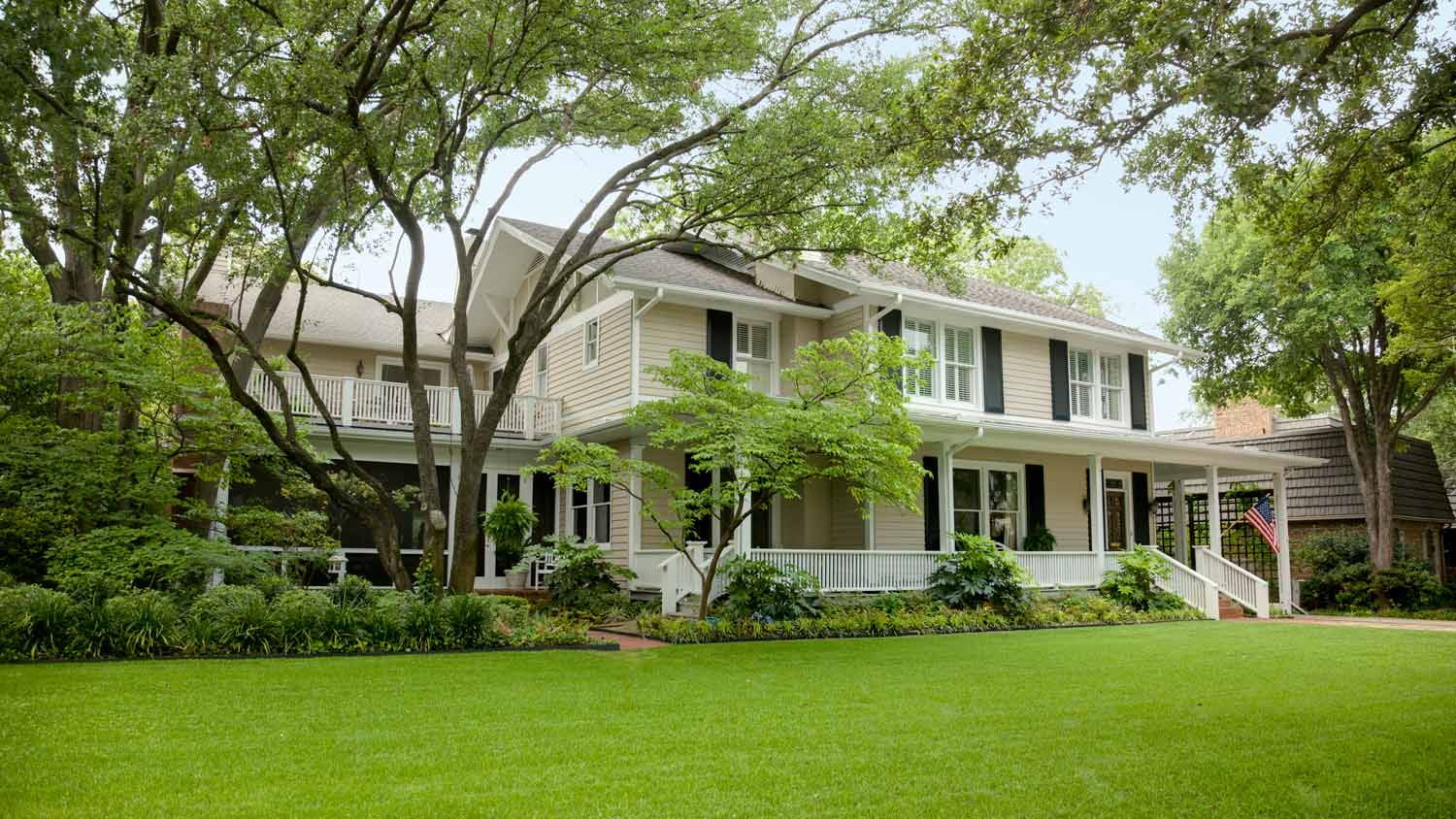 The backyard of a house with large trees