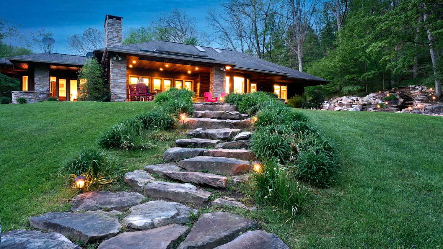 Solar landscape lighting installed in a large backyard