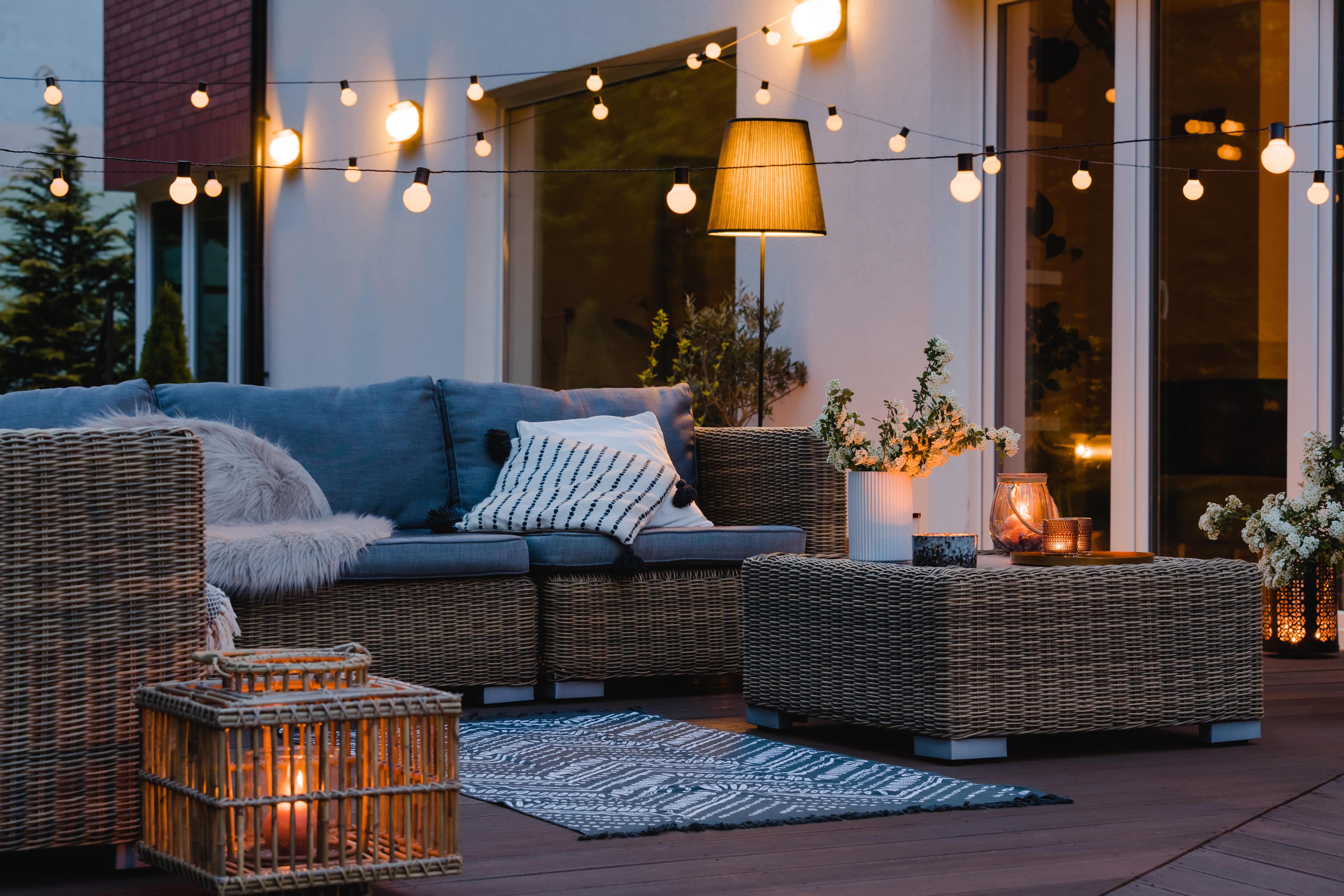 Outdoor patio with string lights and lanterns