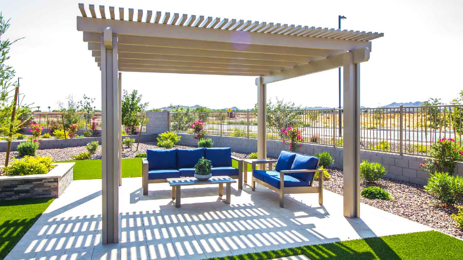A backyard pergola with two sofas