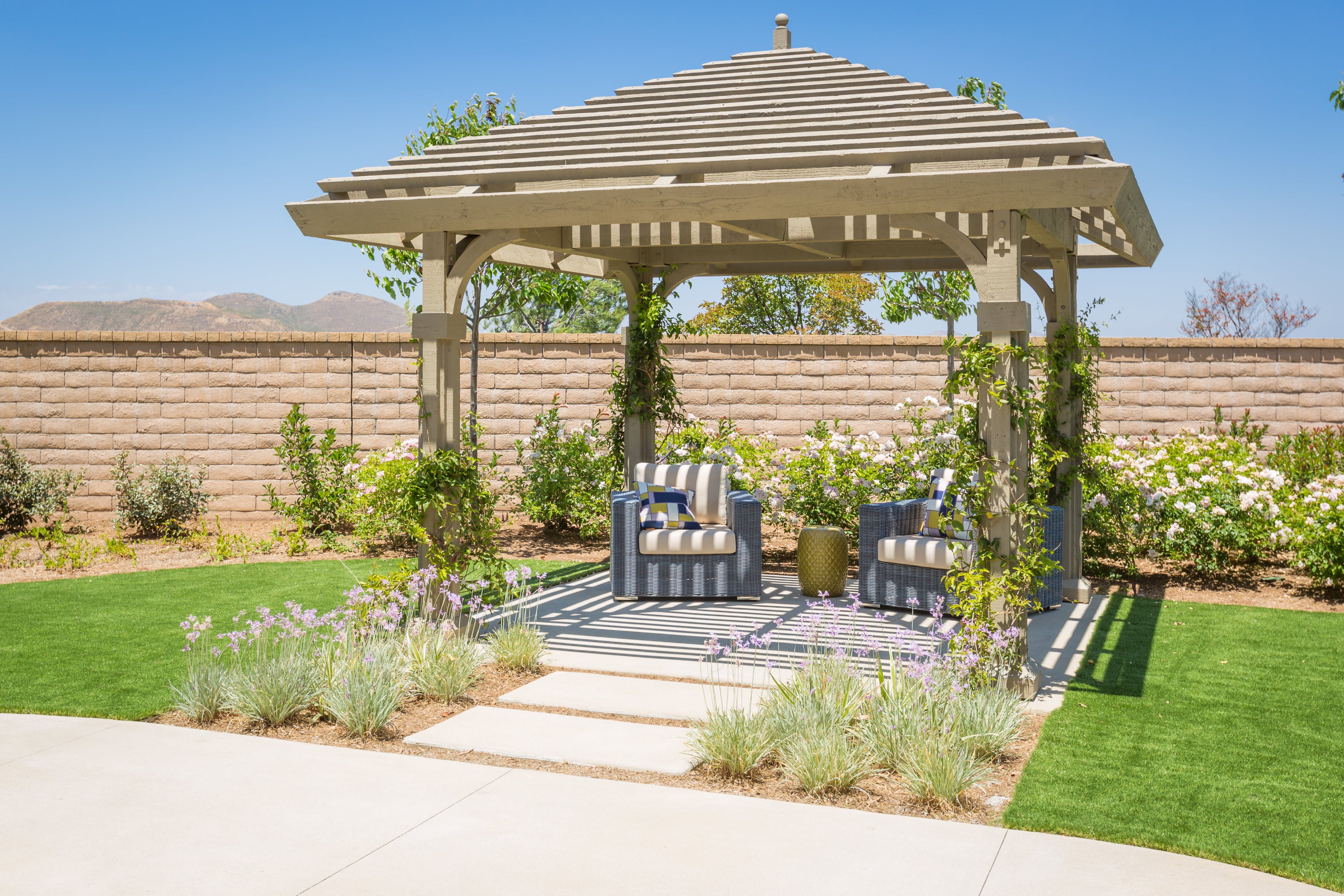 Outdoor pergola with table and chairs