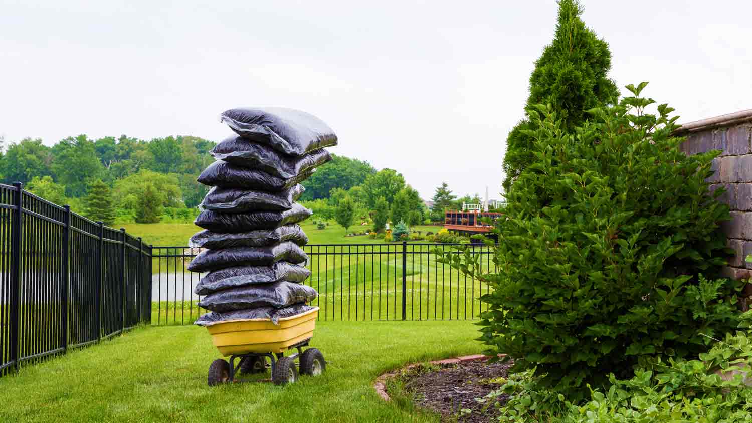 bags of dirt stacked in yard