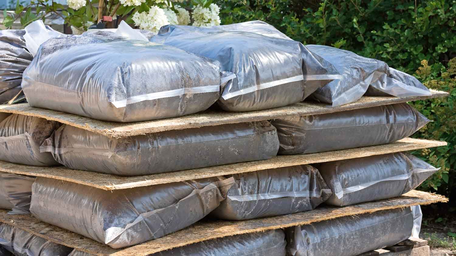 Stack of bags with garden dirt