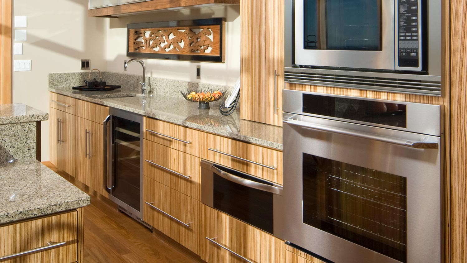 A sunlit kitchen with bamboo cabinets