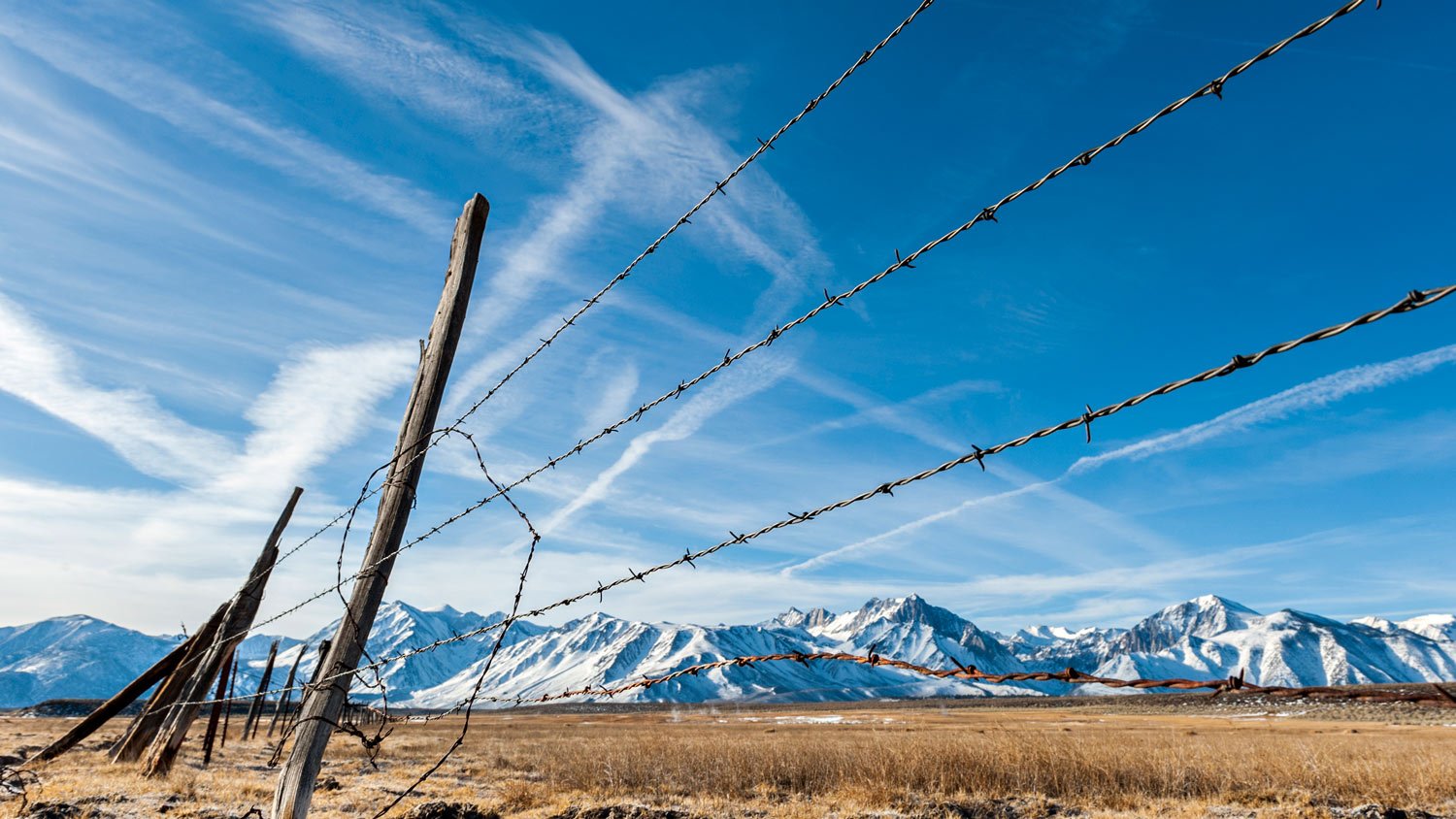 Barbed Wired fence in mountains 