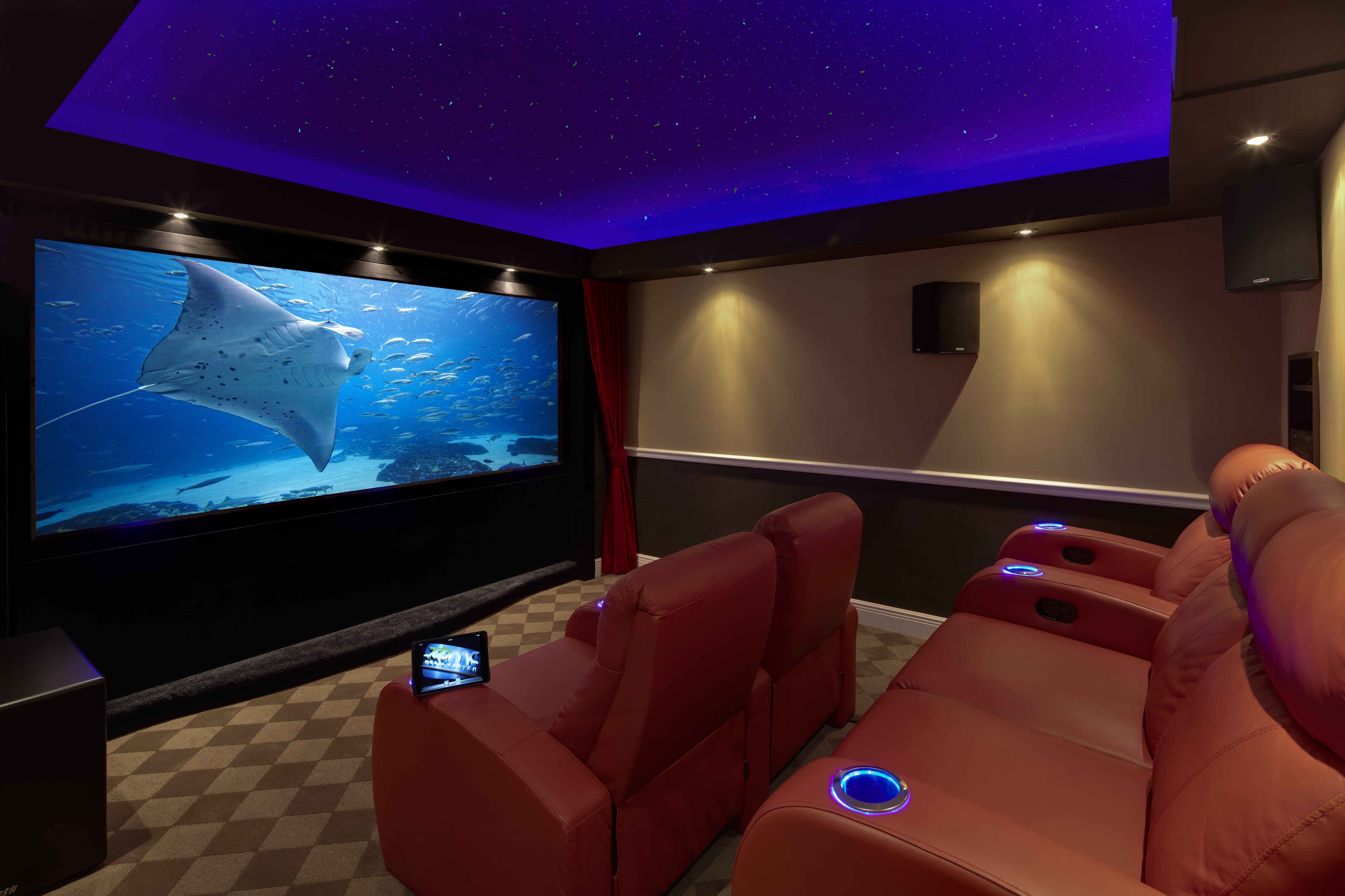 Movie theater in basement with reclining seats