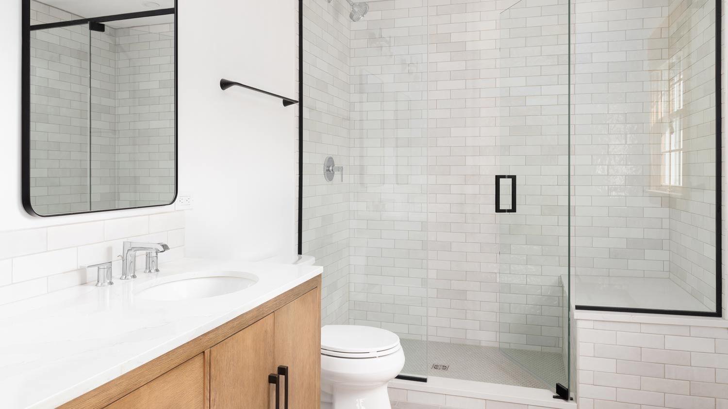 white modern bathroom with black hardware