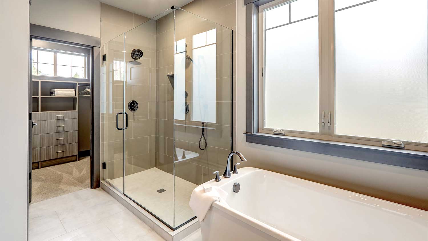 A view of a bathroom with a walk-in shower