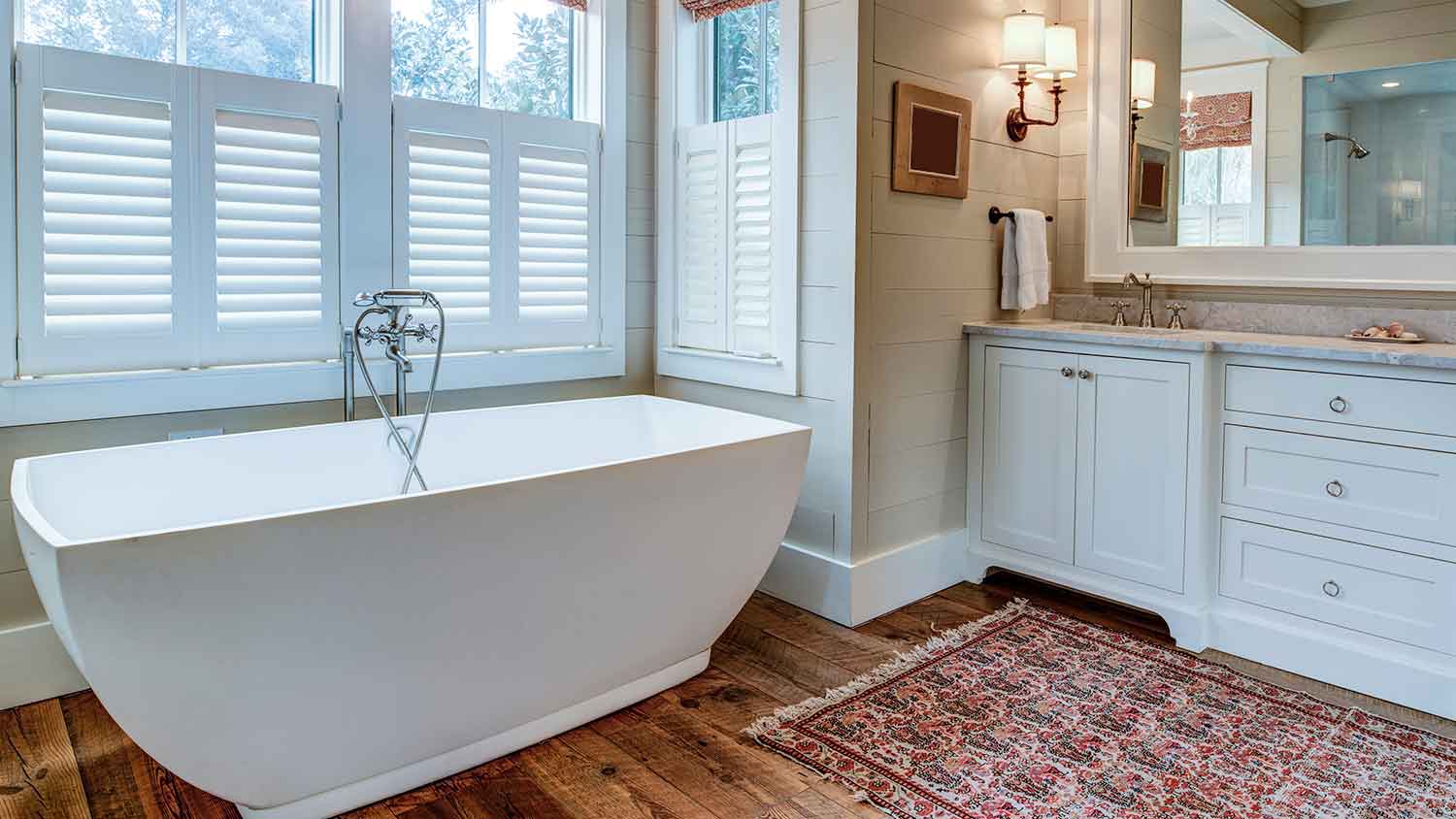 Bathroom with large bathtub in front of a window