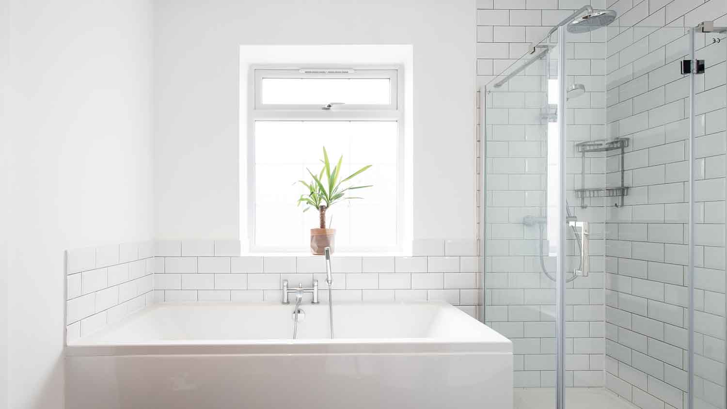 bathroom with picture window above the tub