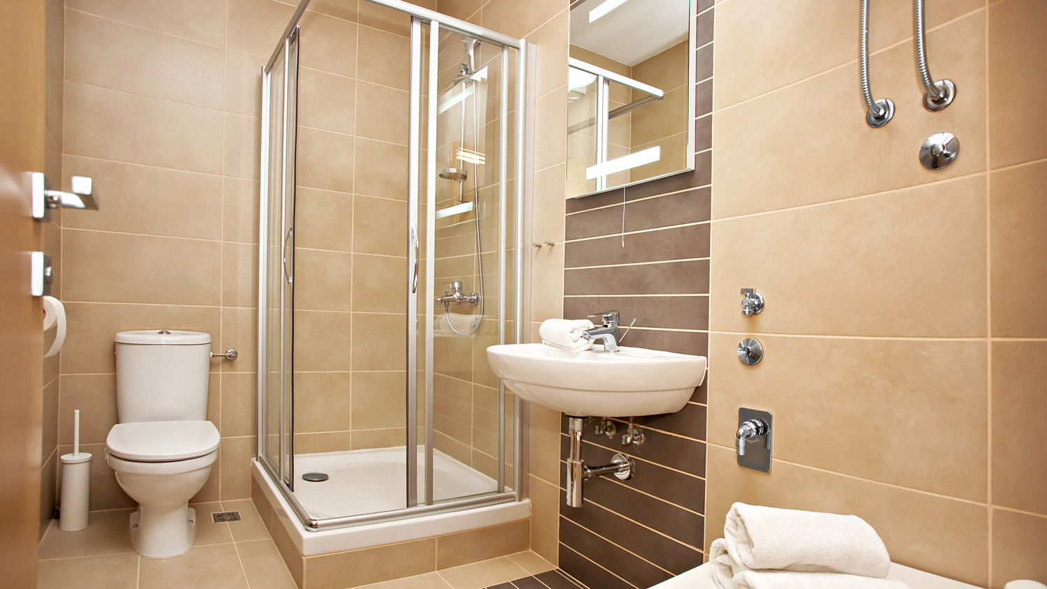Interior of small modern bathroom with shower