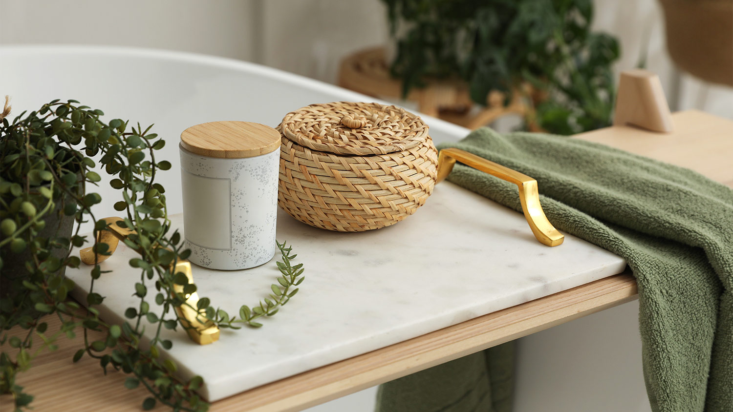bathtub caddy with candle and plants