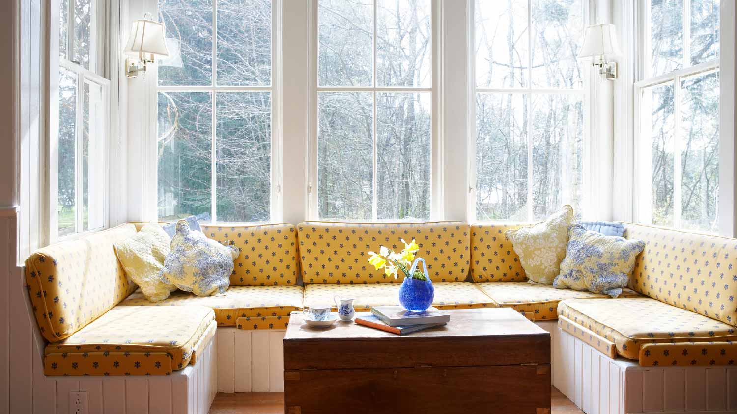 A bay window with a seating area and a table