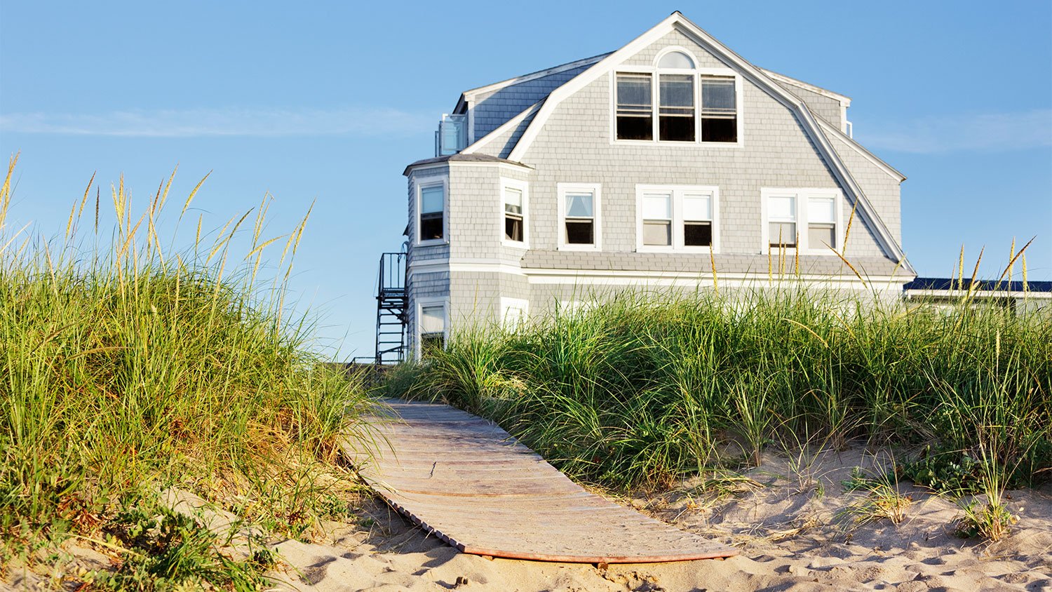 beach house with grass vegetation