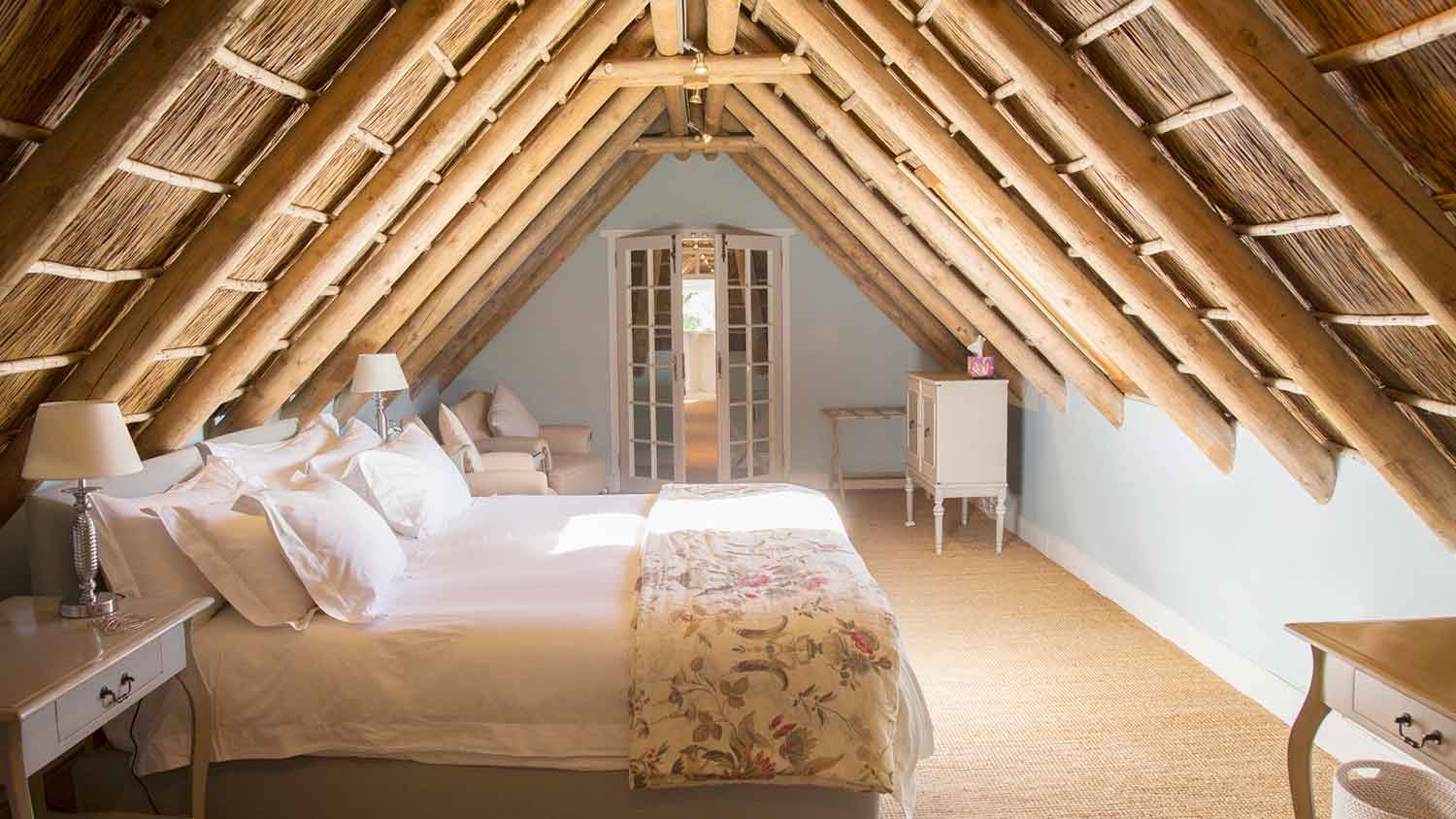 A beautiful bedroom in a hot roof attic