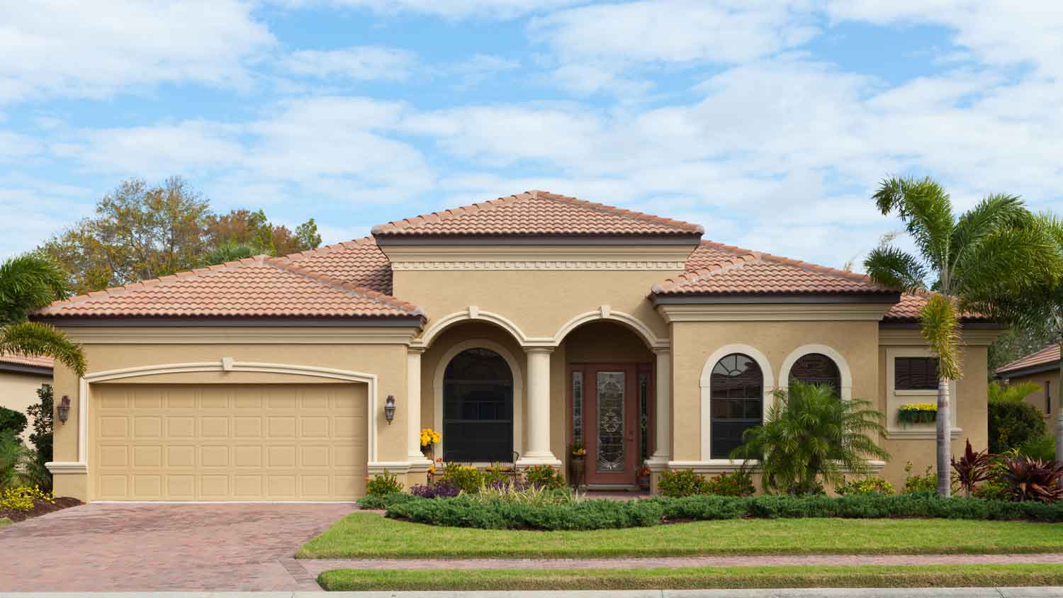 A beautiful stucco house with great landscaping