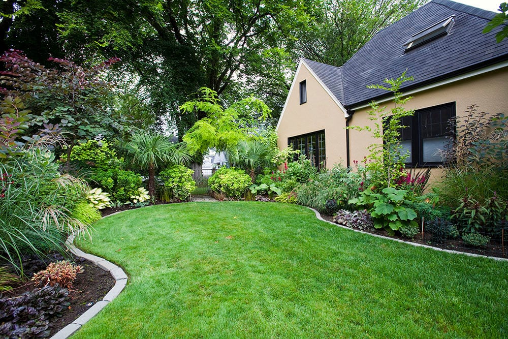 Home with beautifully landscaped yard