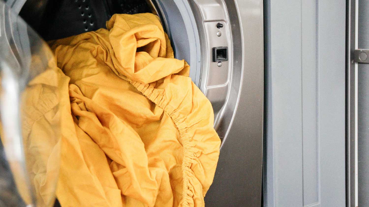 Colorful bedding in the washing machine 