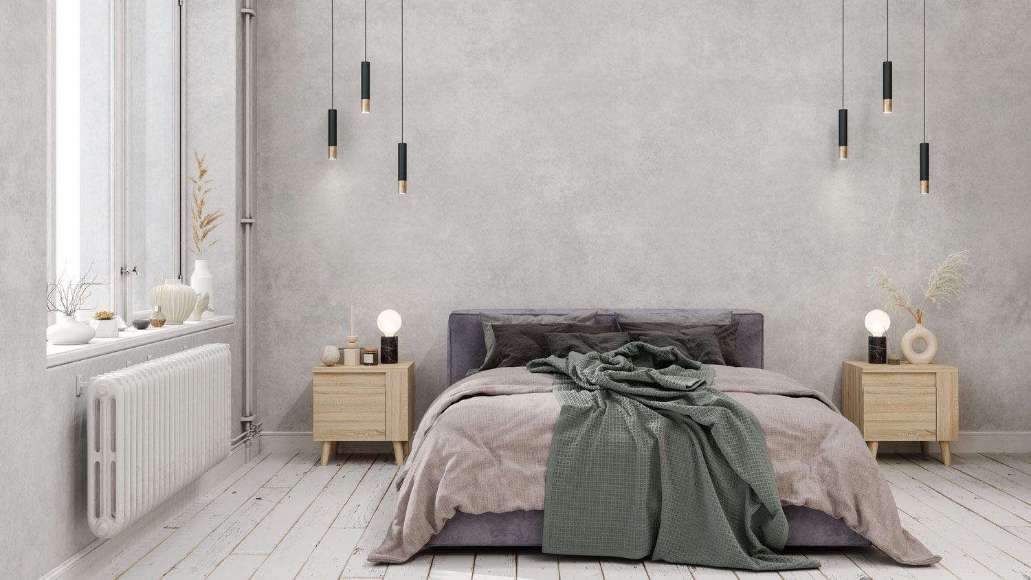 A bedroom with pendant lights and gray walls