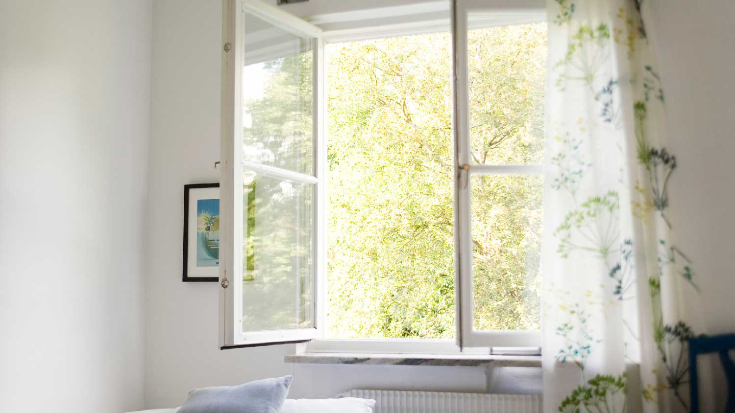 A bedroom with an open window