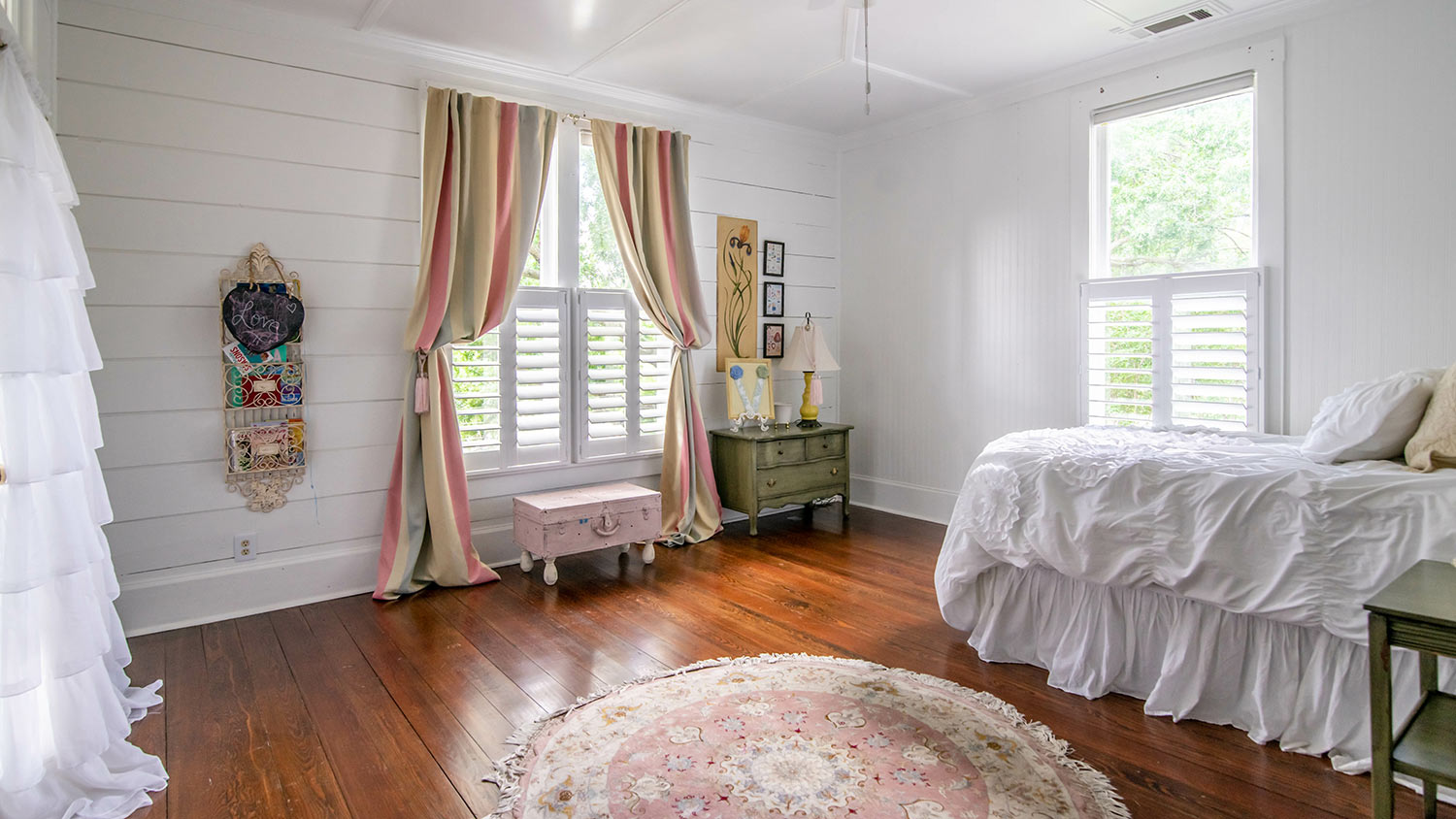 Bedroom in old house with shiplap walls