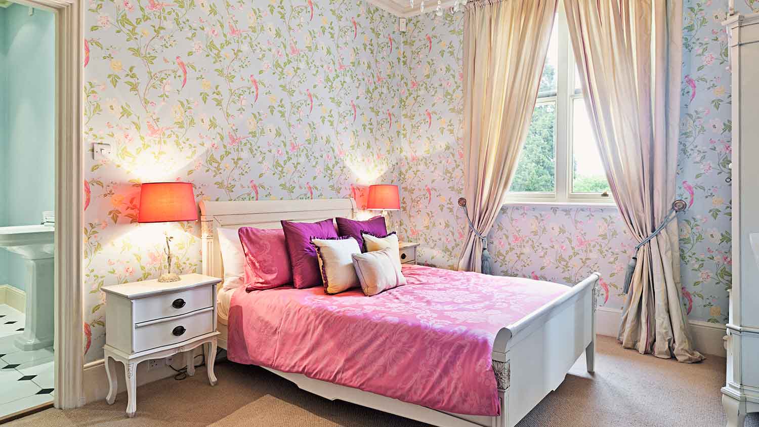 Bedroom with floral wallpaper and a tall ceiling