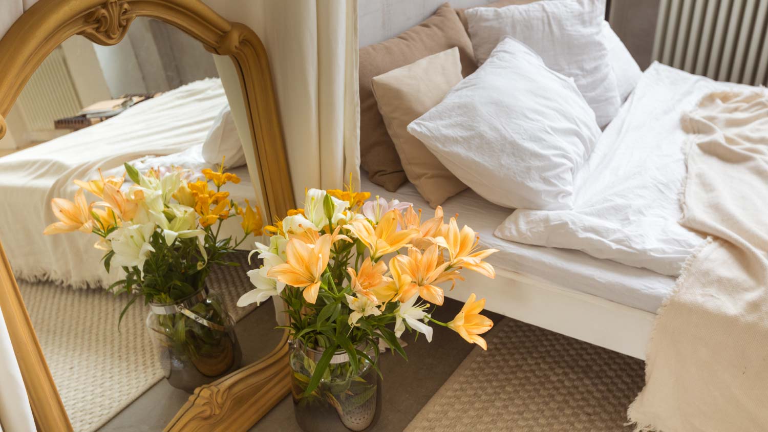 bedroom with large gold mirror