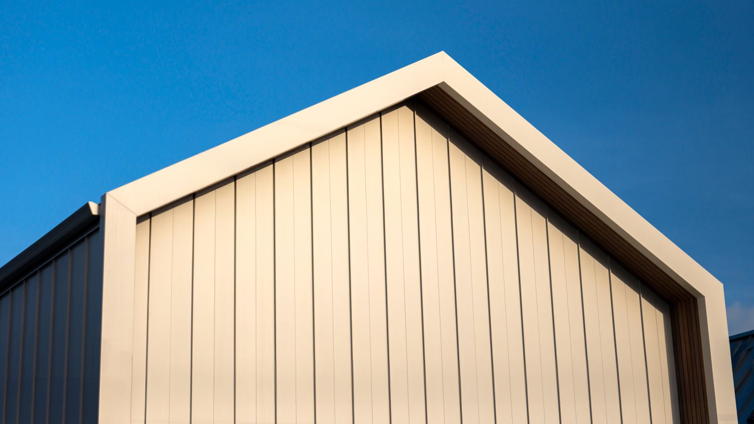 beige home with vertical siding