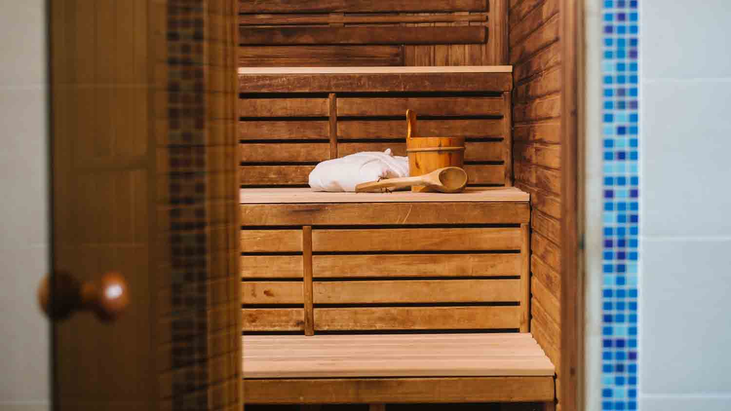 bathrobe on bench in indoor sauna